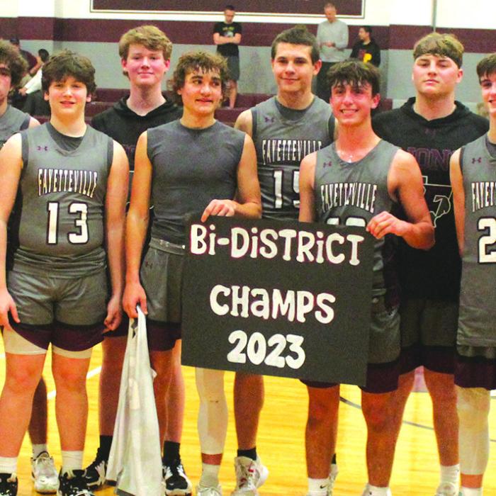 The members of the Fayetteville boys basketball team pose after their playoff win over Nordheim in Flatonia Tuesday. Photos by Jeff Wick