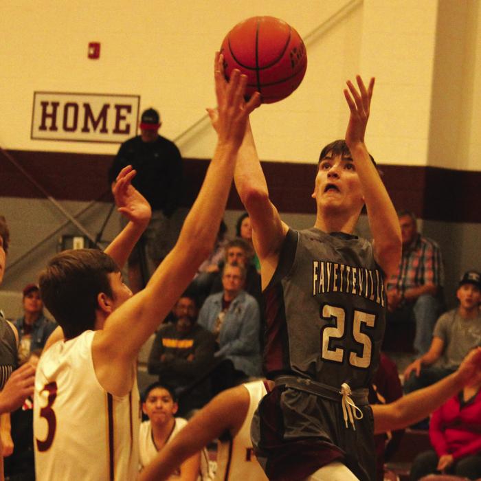 Photo by Jeff Wick Action from Tuesday’s playoff game – left to right: Fayetteville’s Keagan Supak, Karson Corn and Easton Jaeger.
