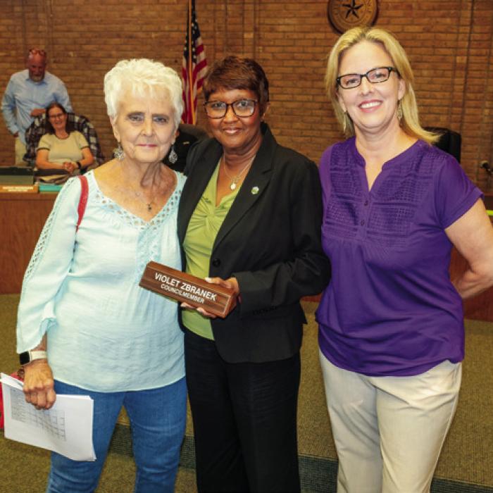 La Grange Mayor Jan Dockery (center) presented outgoing Ward 2 City Council member Violet “Patsy” Zbranek (left) with her nameplate from the Council chamber. They are pictured with City Secretary Janet Bayer (right). Photo by Andy Behlen