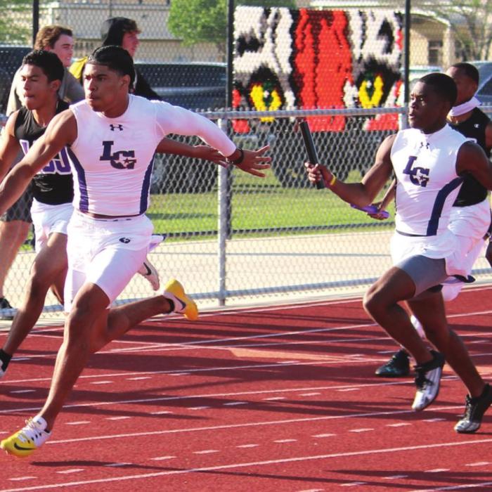 2021 was one of the best years ever for the La Grange boys track team. The Leps finished second in the state in the 4A team standings at the state meet and had a pair of state silver medal relay finishes and a silver medal pole vaulter. Here two members of those relays are shown as Bravion Rogers takes the handoff from Jordan Scott on the final leg of the boys 4x100 relay at the district meet, which La Grange won.