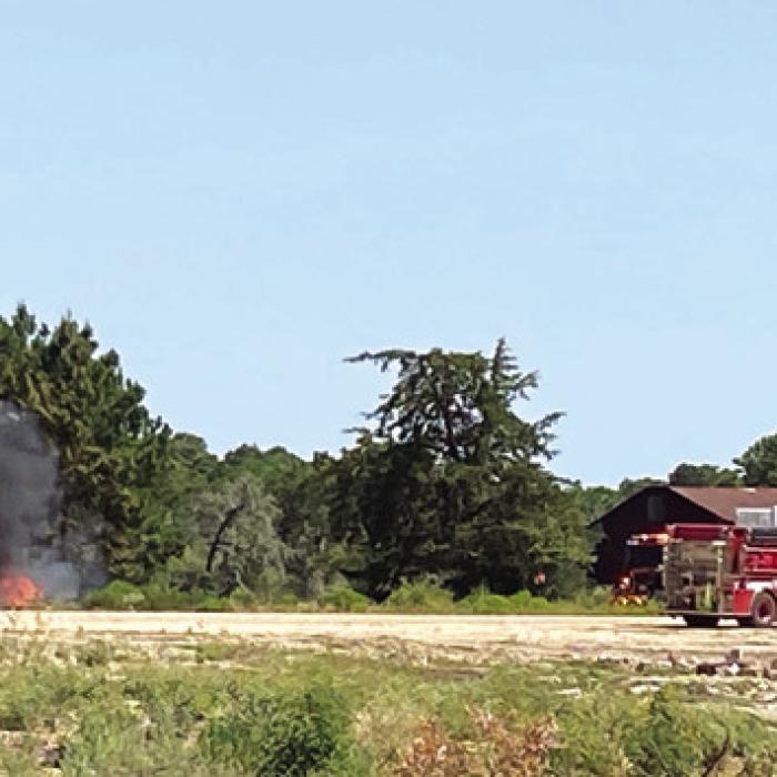 The thick back smoke of the creosote post/railroad tie fire could be seen for miles Saturday. Photo by Eric Skonberg