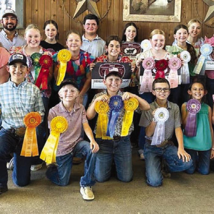 Pictured front from left: Dylan Zweschper, Joe Carrales, Hudson Holub, Tate Fritsch, Emma Zweschper, Abigale McBride, and Coach Kaci Carrales; middle row: Abraham McBride, Rheagan Karisch, Julia Melton, Kinsley Kutac, Adalyn Carrales, Kaisley Janecka, Laramie Laake; back row: Abraham McBride, Coach JoJo Carrales, Alexis Berckenhoff, Logan Poncik, Addison Berckenhoff , Peyton Gilchrest, Tatum Fritsch, Holden Holub, and Rilan Karisch.
