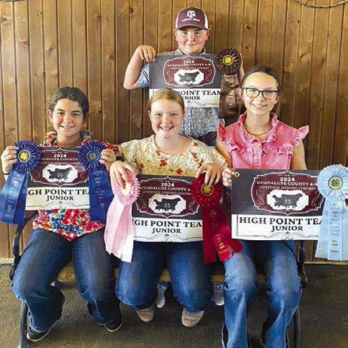Champion Junior Team front from left: Adalyn Carrales, Kaisley Janecka, Tatum Fritsch; back row: Abraham McBride.