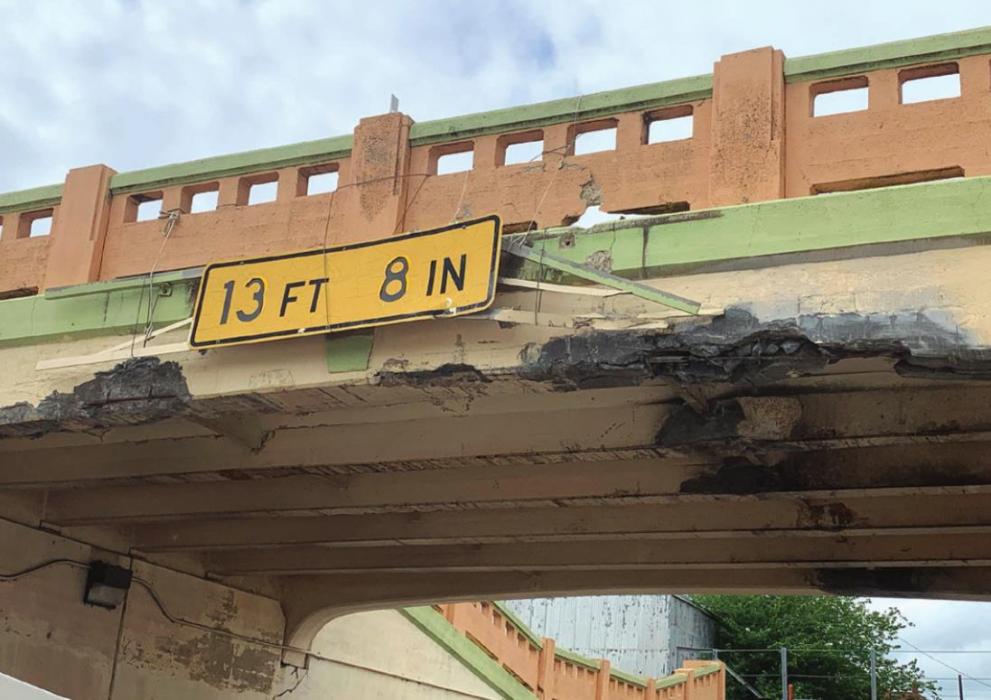 A tall load traveling on US 77 struck the underpass in Schulenburg Wednesday afternoon, April 20. The impact knocked down several chunks of concrete from the bridge overhead. Photo courtesy of Pct. 4 Commissioner Drew Brossmann
