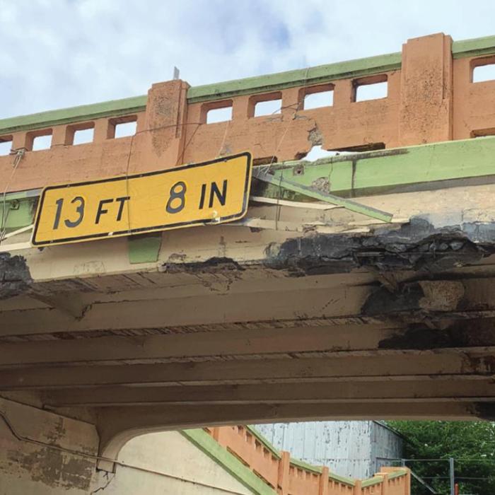 A tall load traveling on US 77 struck the underpass in Schulenburg Wednesday afternoon, April 20. The impact knocked down several chunks of concrete from the bridge overhead. Photo courtesy of Pct. 4 Commissioner Drew Brossmann
