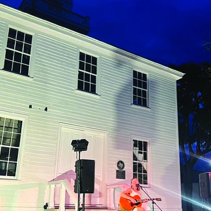 A photo for a previous year’s performance on the courthouse square in Fayetteville.