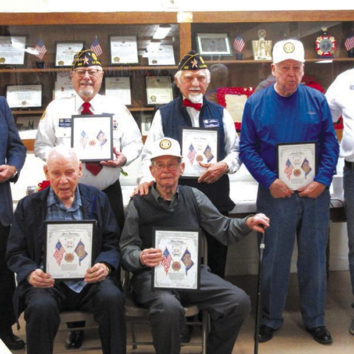 American Legion Post 102, awarded Service Awards, ranging from 32 years to 49 years of service which included (seated, from left) Gilbert Freudenburg, Melvin Schilling, (standing) Weldon Koenig, Glenn Altwein, John D. Marburger, J.R. Baca and Post Commander Richard Gray.