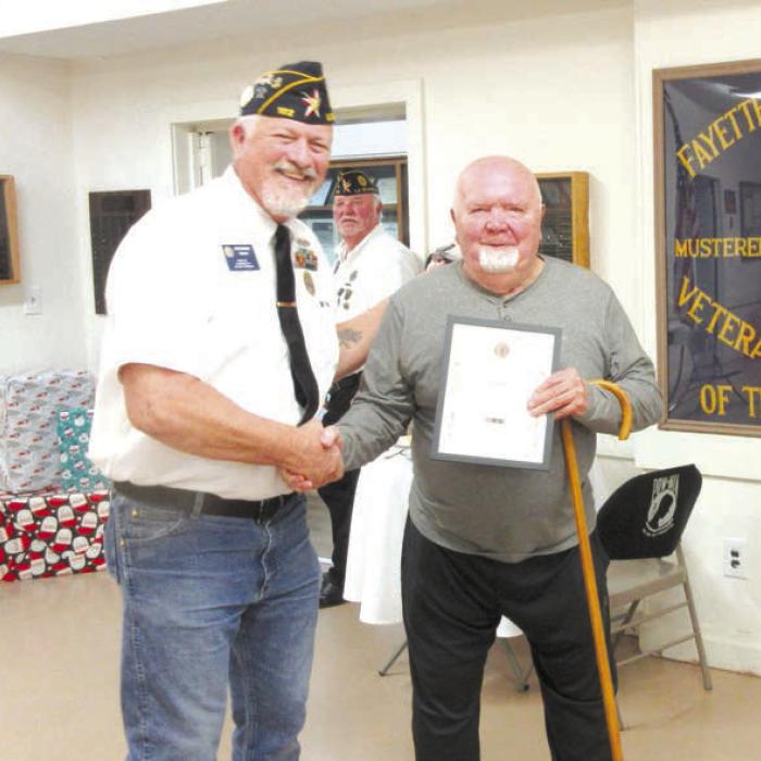 The American Legion Bronze Medal awarded to Ray Thurman for his work with the La Grange Little League by Post Commander Richard Gray.