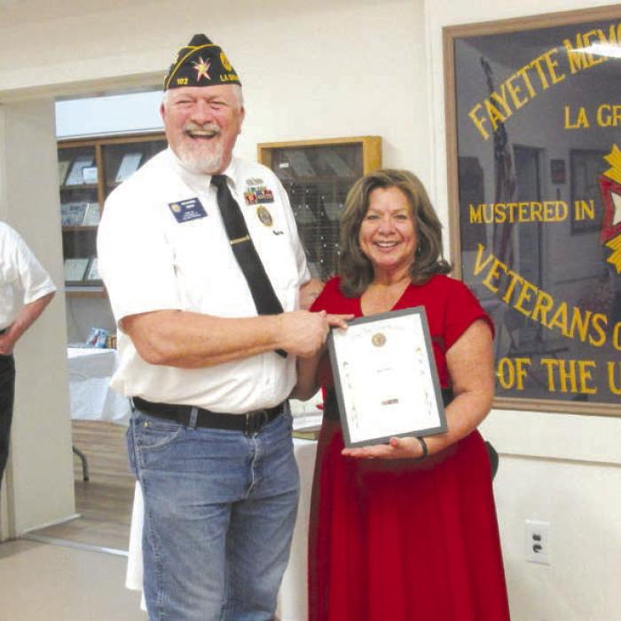 The American Legion Silver Medal was awarded to Post Adjutant Mary Gray for her outstanding work as Adjutant for the past years by Post Commander Richard Gray.