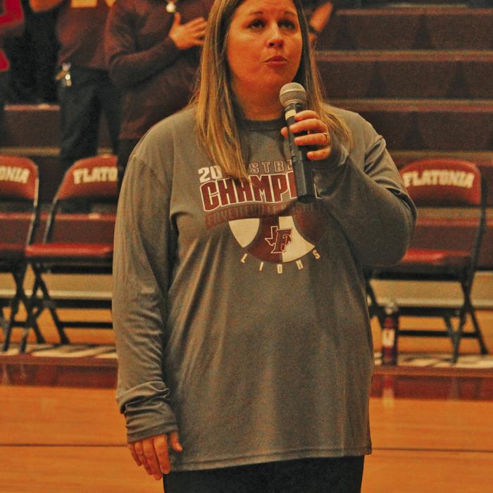 When the sound system wasn’t working at the Flatonia gym before the basketball playoff game there, Flatonia ISD’s Robin Branecky asked for volunteers to sing the National Anthem. Fayetteville principal Brynn Lopez answered the call and wowed the gym with her rendition of the song. Photo by Jeff Wick