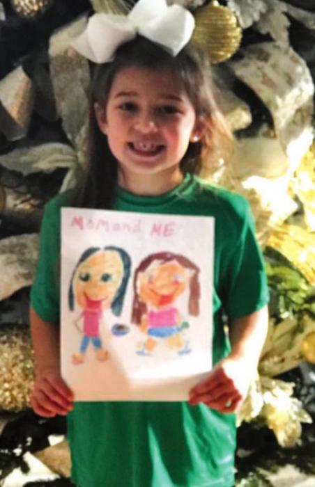 Ella Banse, daughter of Lacy and Adam Banse, with her picture “Mom and Me.”