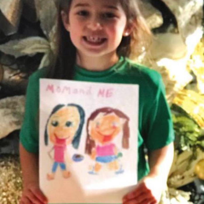 Ella Banse, daughter of Lacy and Adam Banse, with her picture “Mom and Me.”