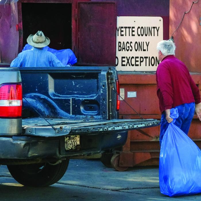 “We’re seeing every bit of two-and-a-half tons more every week in trash,” said Recycling Center manager Paul Zapalac. “Before, we’d normally see 10 tons a week. Now it has increased at least 20 percent.” Photo by Andy Behlen