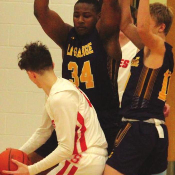 Lep junior Jaren Woods and Jacob Chovantez block this Salado player’s path to the basket.