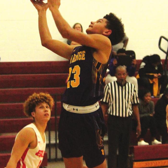 La Grange’s Nate Scott drives to the basket Tuesday. His seven fourth quarter points fueled a Leps comeback. Photos by Jeff Wick
