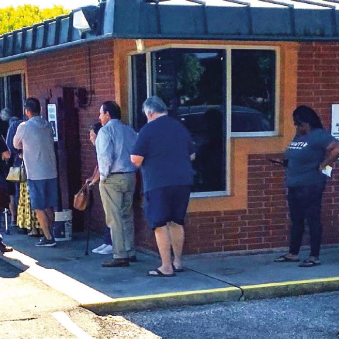 Turnout on the first day of early voting was especially high in Fayette County, with a line forming outside the elections office Monday morning.