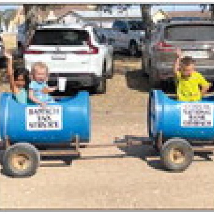 Isabella and Hayden Bankhead and Blake Brown enjoyed the kids train rides at The Holy Cross picnic.