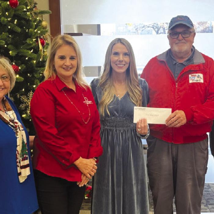 Prosperity Bank recently made a donation to the Texas Ramp Project. Pictured from left are Barbara Janacek, Marsha Hutton, Ashley Firkins, Frank Smith with the Texas Ramp Project, and Lily Rios. The Texas Ramp Project builds ramps at homes for local folks who have mobility issues. Photo by Jeff Wick