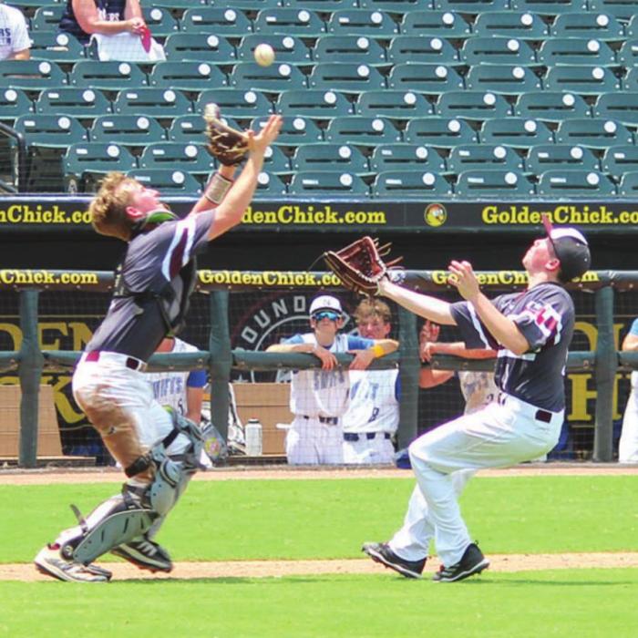 Fayetteville catcher Logan Fritsch readies to make a catch on a pop-up Wednesday as pitcher Reid Gross backs up the play as insurance.