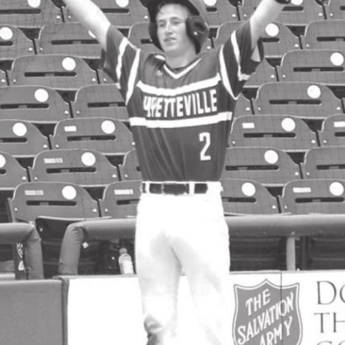 Fayetteville’s Logan Fritsch motions back to the dugout as he stands on third base after his second triple of the semifinal.
