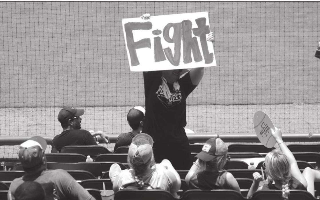 A Fayetteville fan holds up a sign Wednesday.