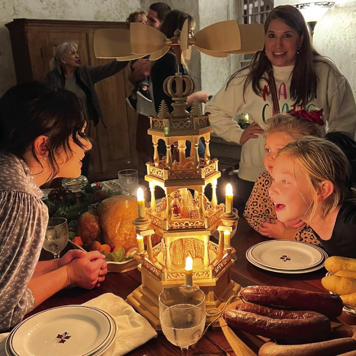 Attendees enjoying historic Christmas decorations inside the Kreische Home.