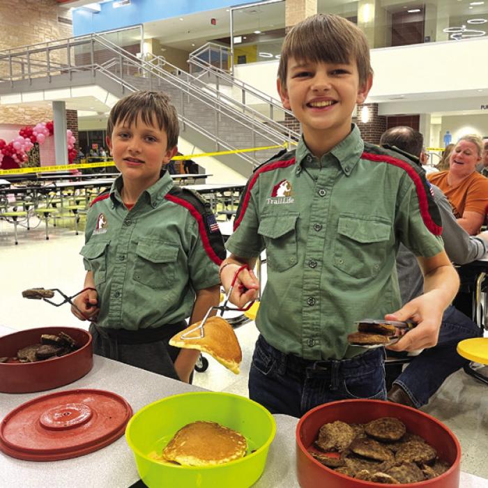 The La Grange Rotary Club held it’s 70th annual Pancake Supper Thursday with dine-in and drive-through options at the La Grange Elementary. Here’s a picture from the event, a couple of helpful scouts serving sausage patties and pancakes, part of a whole army of volunteers that helped make the event happen. Photo by Jeff Wick