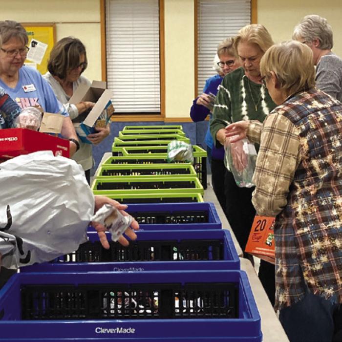 Members in attendance filled goodie bags for active Fayette County teachers and staff.