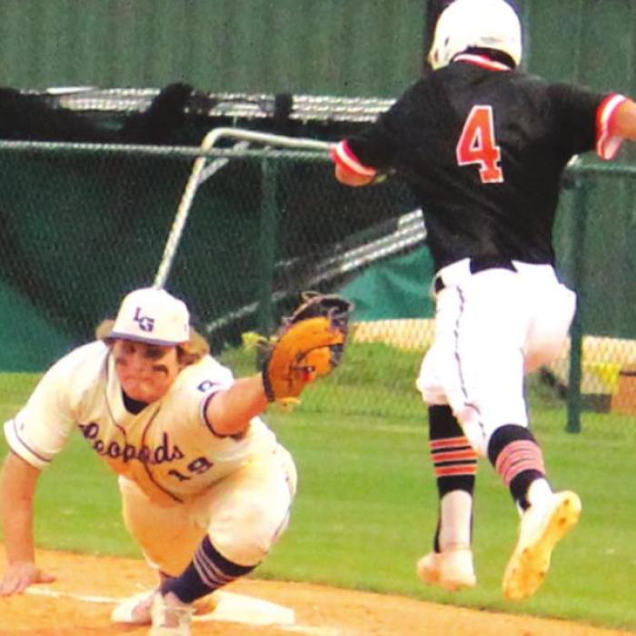 La Grange’s Braeden Wilder appears to make a great snag of a throw while staying on the base Thursday. Instead of this being a third out of the first inning, the runner was called safe and Smithville rallied for three more runs in that frame. Photo by Jeff Wick