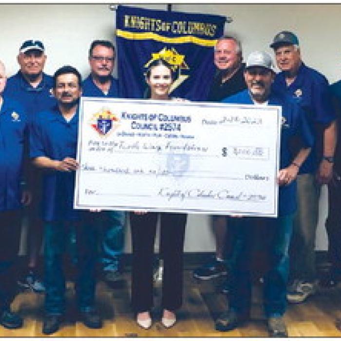 The Knights of Columbus Council No. 2574 presented Turtle Wing Foundation with a generous donation. The Knights of Columbus members in attendance from left: Richard Hoffmann, Marcus Recek, Randy Proske, Philip Rocha, Ralph Dunk, Charles Youngblood, Hector Cervantez, Pat Lyons, Gary Antosh, and Jim Kothmann. Also pictured in the center is the Executive Director of Turtle Wing Foundation, Destiny Psencik.
