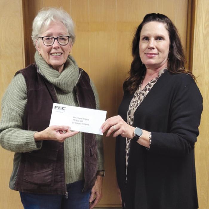 Funds donated by members of Fayette Electric Cooperative were donated to the Mini Horse Helpers. Pictured from left to right are: Mini Horse Helpers Vice President/Executive Director Sally Van Duyn and Fayette Electric Cooperative Marketing and Training Coordinator Tracy Denton.