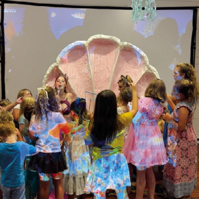 Mermaids dropped in the community center to teach about marine life.