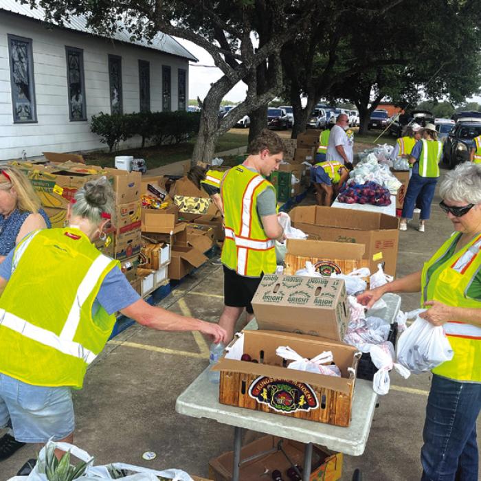 Locals Pass Out 7,813 Lbs. of Food in Waldeck