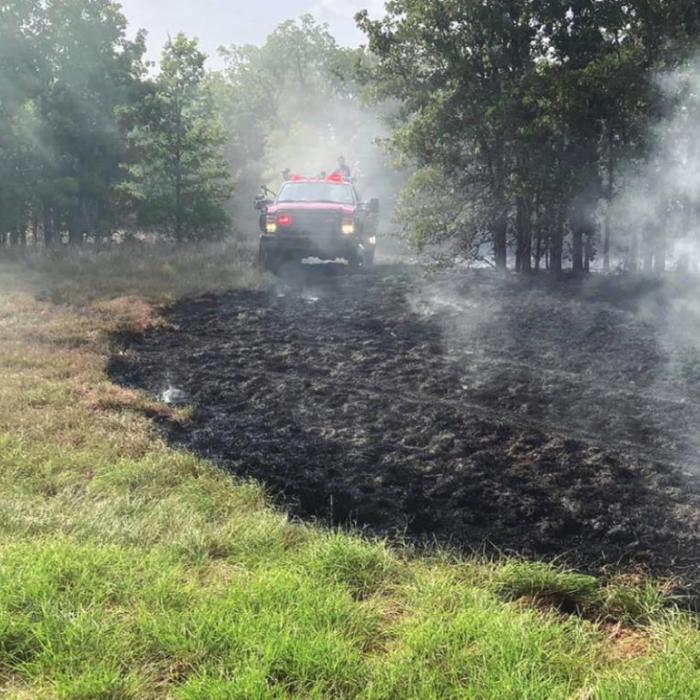 Above, firefighters work to contain a grass fire that started along Interstate 10 near Flatonia. Below, Schulenburg Police and Sheriff’s Deputies stopped a car for reckless driving and wound up arresting a woman on smuggling charges.