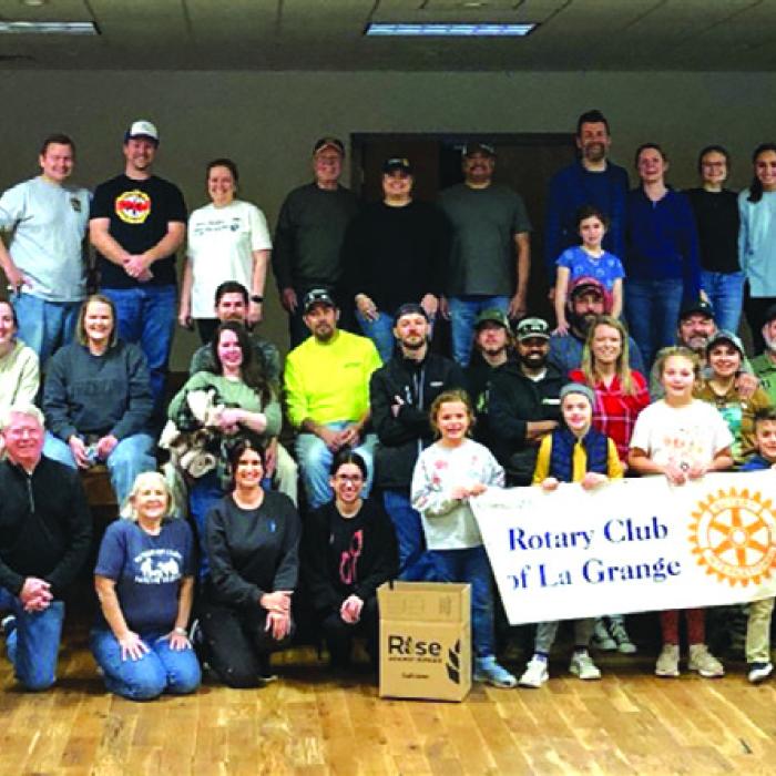Some of the attendees at Saturday’s meal packaging event pose for a group photo.