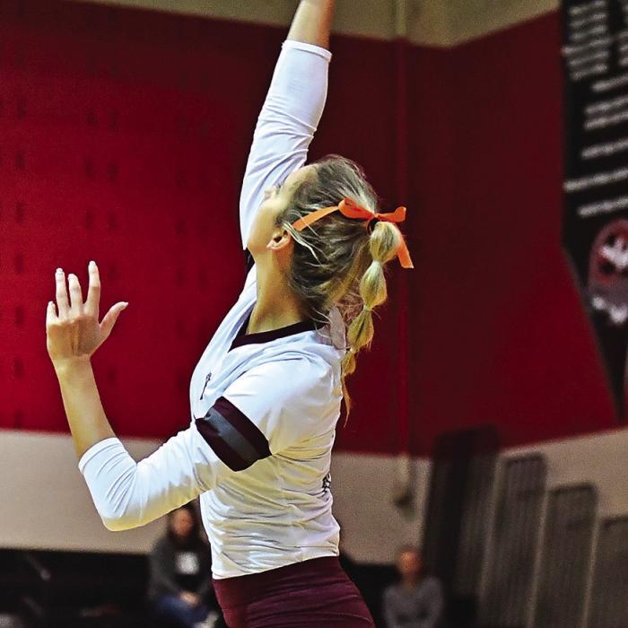 Senior Braidy Fike goes up for a hit in Tuesday night’s Bi-District playoff game.