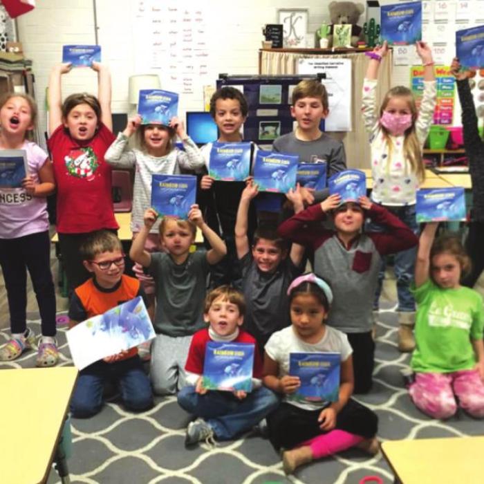 1st graders jazzed about reading “The Rainbow Fish” by Marcus Pfister and J. Alison James.