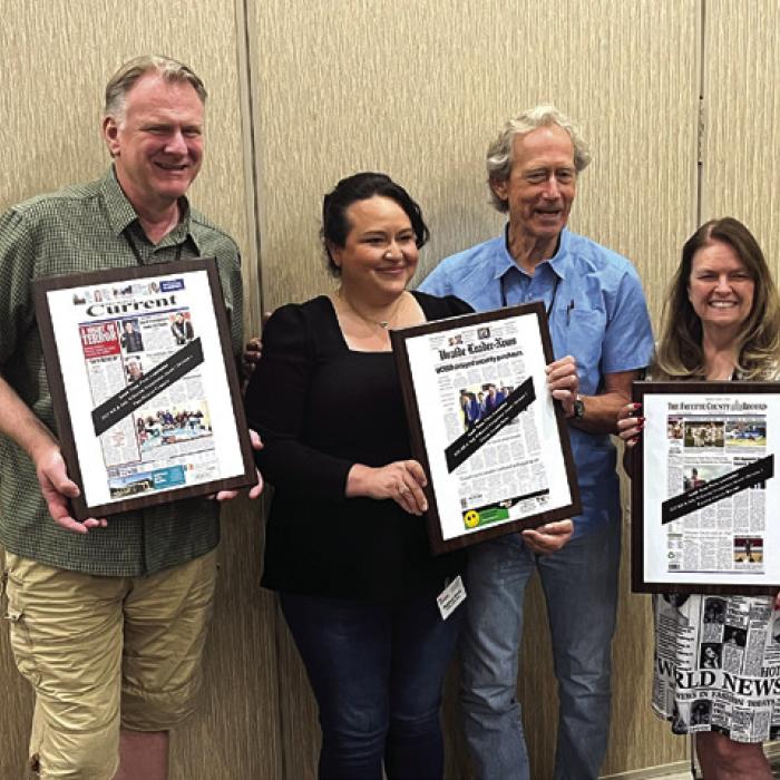 Sweepstakes winners in the South Texas Press Association’s annual newspaper contest, awarded Friday in New Braunfels – Left to right: Marc Robertson of the Frio Nueces Current in the small weekly division, Meghann Garcia and Craig Garnett of The Uvalde Leader-News in the large weekly division, and Regina Keilers of The Fayette County Record in the semi-weekly division.