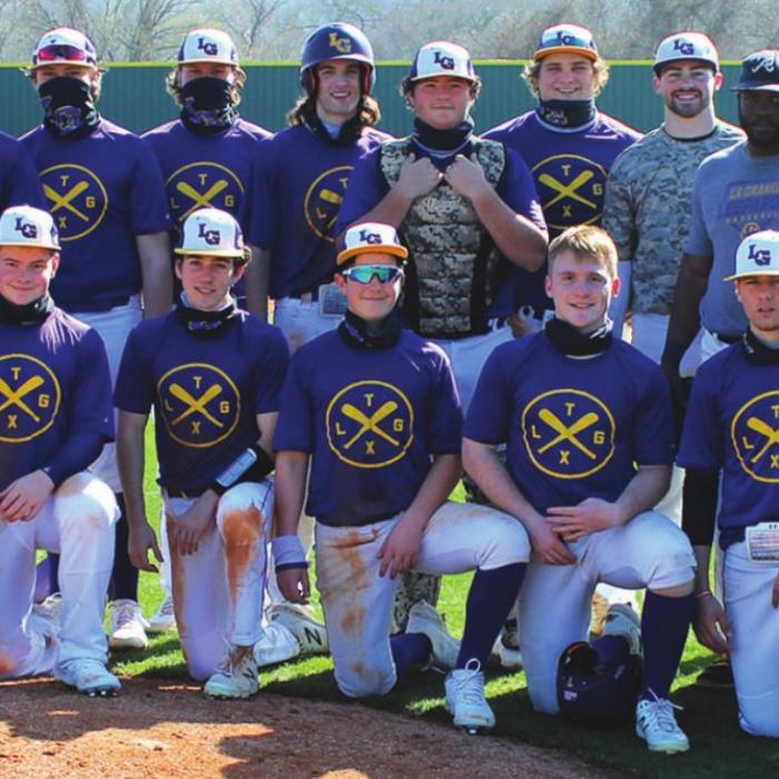 The members of the La Grange baseball team pose with the members of the alumni squad after Saturday’s scrimmage. Photo by Jeff Wick