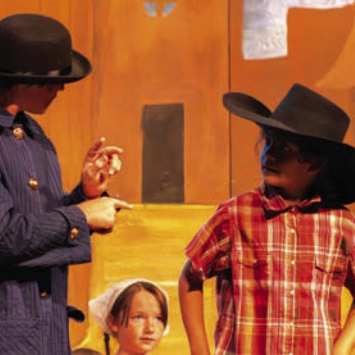 Caden Janda, left, played a character who only communicated via sign language in the play.