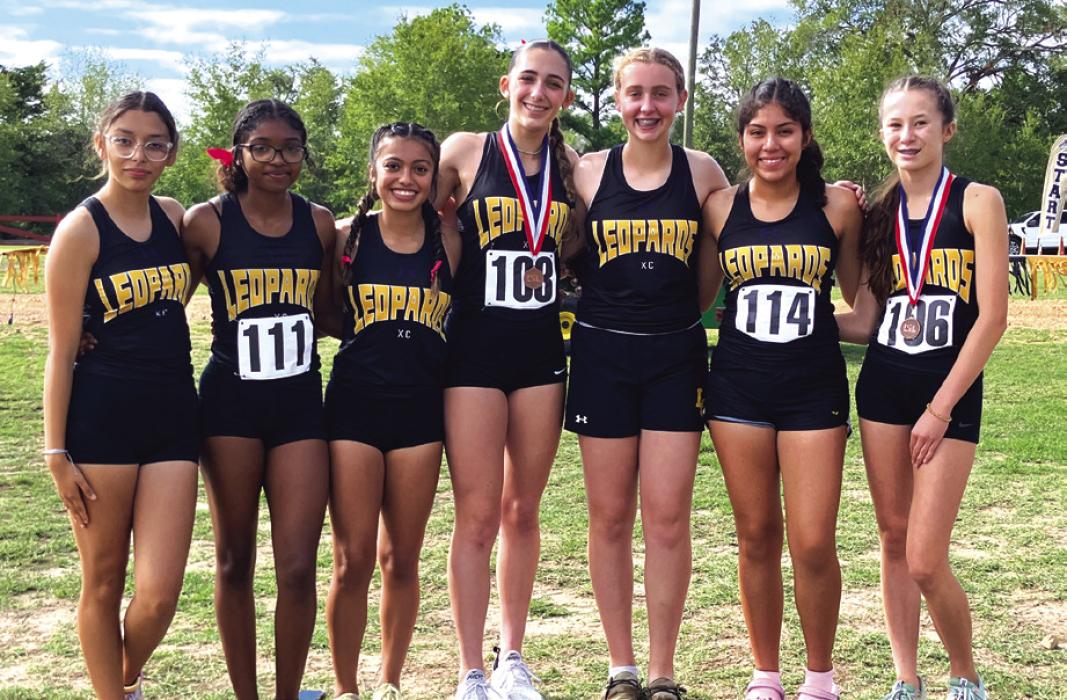 The members of the Lady Leps varsity cross country team pose after their district meet last week. Individual medalists for the Lady Leps were: Eleanor Carey (4th, far right), Faith Greenwood (8th, fourth from left). Other team members included: Alley Olvera, CeCe King, Hannah Gross, Abril Garcia and Brisa Soto.