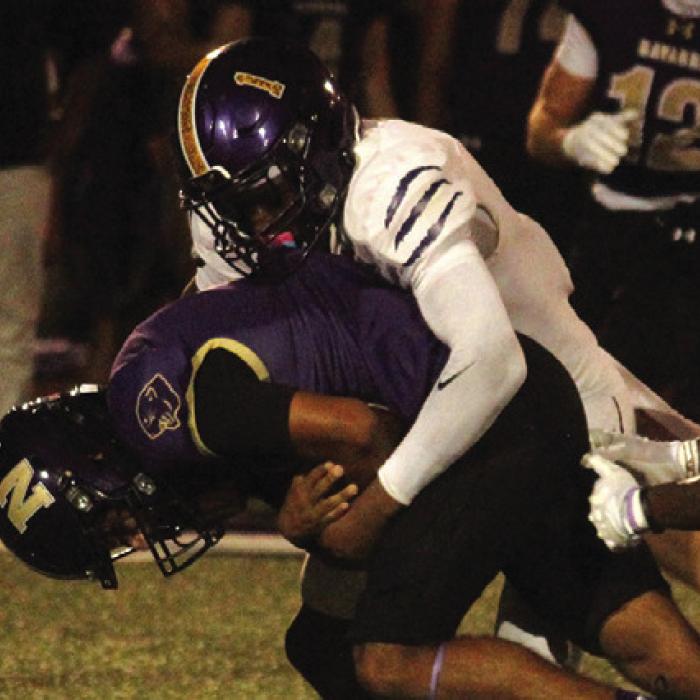 La Grange’s Trey Broussard tackles a Navarro ballcarrier Friday. Photo by Jeff Wick