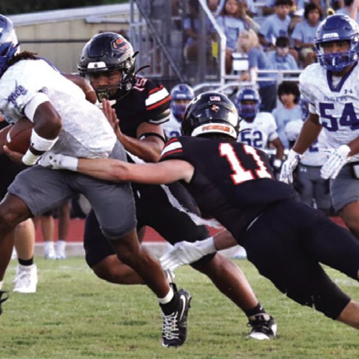 Schulenburg’s Nick Goode makes a diving tackle Thursday. Photo by Audrey Kristynik