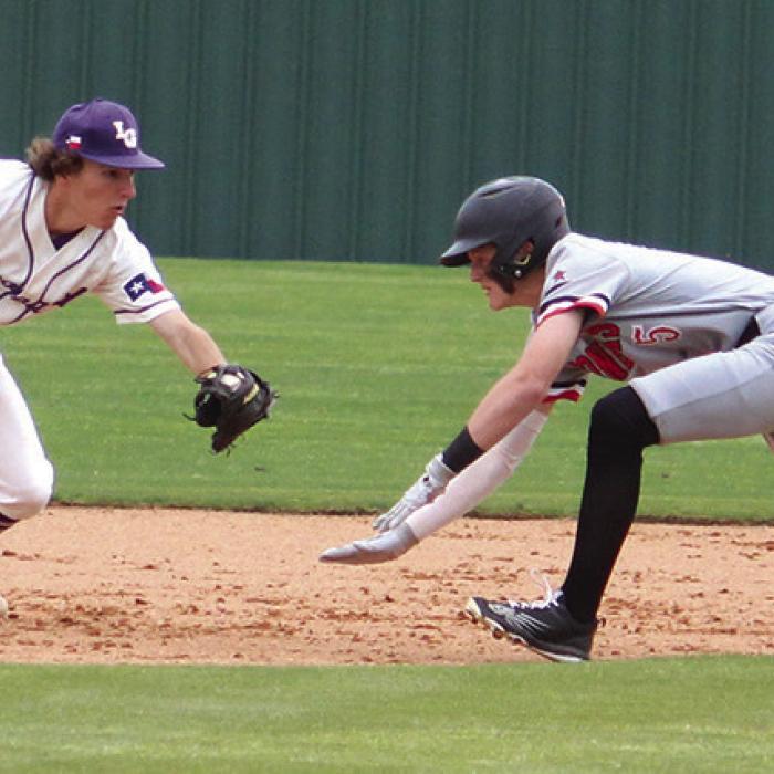 Cody Kruse tags out a stealing Gonzales baserunner.