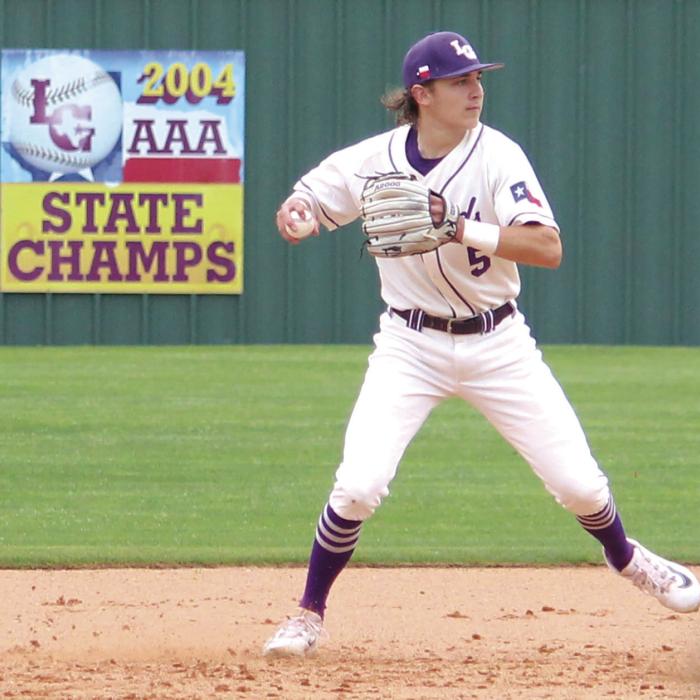 After getting an out at second La Grange shortstop Bennett Barber makes a throw to first to try to get a double play.