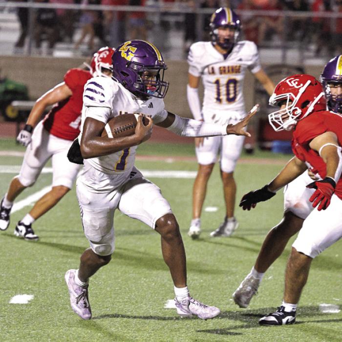 La Grange’s Trey Broussard picks his way through the Cardinals defense on his way to a 97-yard kick-off return for a touchdown Friday. Photo by Darrell D. Gest