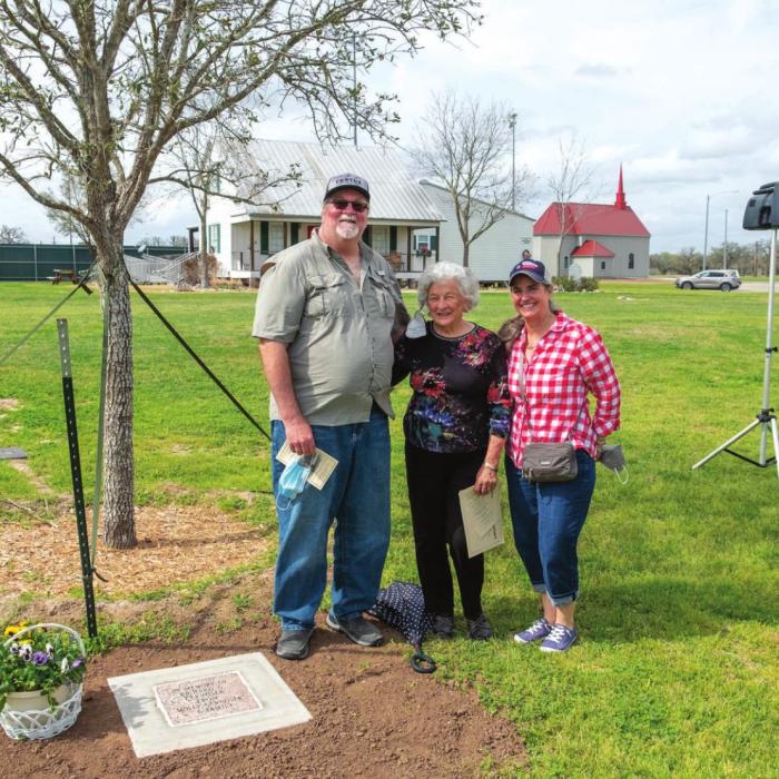 One of the six trees was dedicated in honor of the late Richard Cernosek of La Grange. Pictured beside the tree are his children and widow: Chris, Molly and Carmen Cernosek. Photos by Andy Behlen