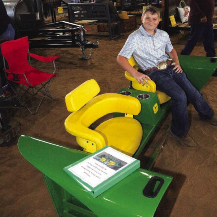 The Blinn College District Agricultural Sciences Program marked a major milestone with the 25th anniversary of its annual Ag Mechanics Show, welcoming nearly 300 entries and introducing a new award recognizing student excellence in showmanship. Class winners included Flatonia FFA in Class 1. Pictured here is Cooper Riley’s project was a John Deere tractor bench, made from parts of John Deere tractors from the 1960s. Riley is from the Round Top Carmine FFA.