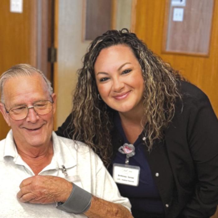 Brittney Jones with True Care Living came to our Weimar program at First United Methodist Church to do blood pressure checks. She quietly made her way around the room, not disturbing the domino games being played.