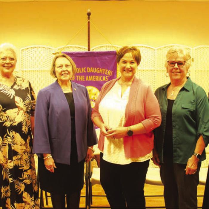 Milestone membership pins were presented, from left, State Regent Virginia Olsovsky, Regent Sherry Hebert, Vice Regent Marilyn Kothmann, twenty-five-year member Jennifer Sanders, fiftyyear member Claudean Saunders, Fr. Chris Smith. Unable to attend was fifty-year-member Delphine Rohan. Photos by Jeff Wick
